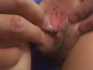 Japanese slut with a pig tail displays her wet pussy